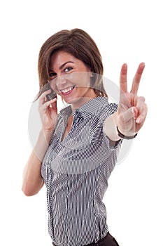 Business woman with phone and victory gesture