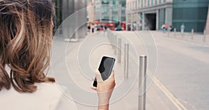 Business woman, phone and walking with text outdoor in the city checking social media and clock for work. Professional
