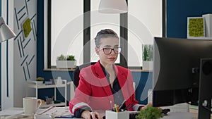 Business woman planning marketing statistics charts on computer