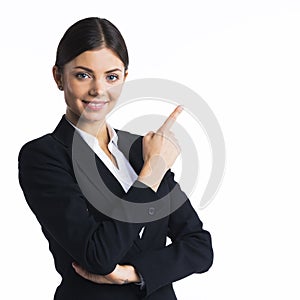 Business woman pointing at copyspace