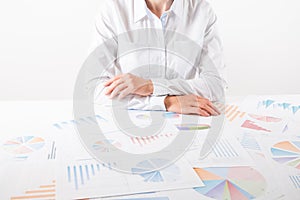 Business woman pointing at graph document close-up