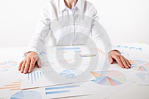 Business woman pointing at graph document close-up