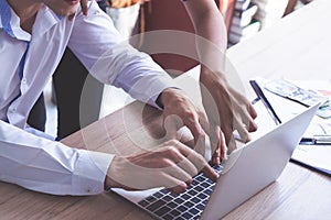 Business woman pointing on laptop screen, Coworker brainstorm