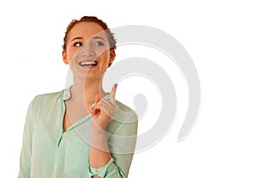 Business woman pointing to copy space while presenting a product
