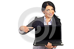 Business woman pointing to laptop screen