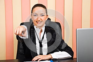 Business woman pointing to you