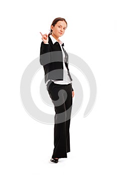 Business woman pointing up at copyspace