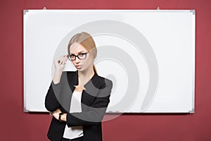 Business woman pointing at the whiteboard