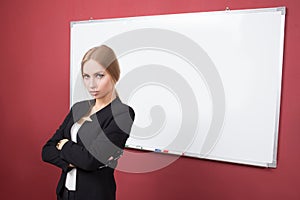 Business woman pointing at the whiteboard