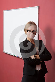 Business woman pointing at the whiteboard