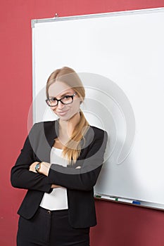 Business woman pointing at the whiteboard