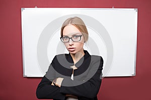 Business woman pointing at the whiteboard