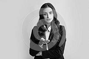 Business woman portrait. Attractive young pretty cheerful businesswoman in suit, isolated gray background. Female office