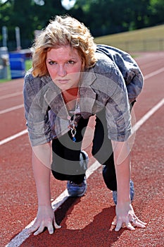 Business woman preparing to run a race