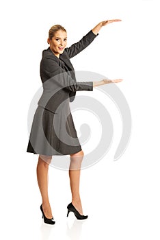 Business woman presenting a copyspace
