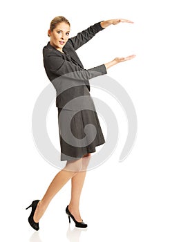 Business woman presenting a copyspace