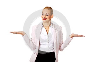 Business woman presenting something on open palm