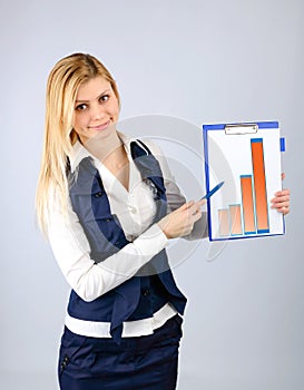 Business woman presents the company's revenue in the graph on the tablet