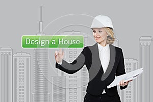 Business woman pressing desing a hause button on virtual screens. Residential Blocks. Business, technology, internet and
