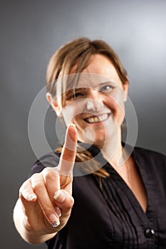 Business woman pressing an imaginary button