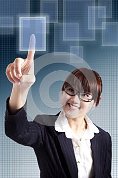 Business woman pressing a touchscreen