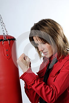 Business woman and punching bag