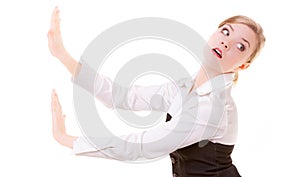 Business woman pushing away invisible obstacles copy-space isolated