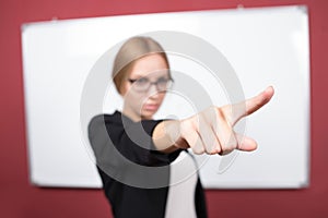 Business woman pushing on a touch screen interface