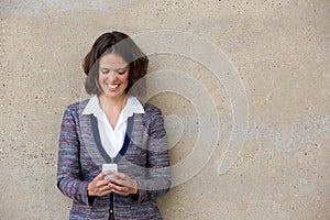 Business woman reading text message on mobile phone