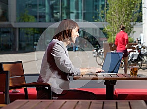 Business woman reading text message on mobile phone