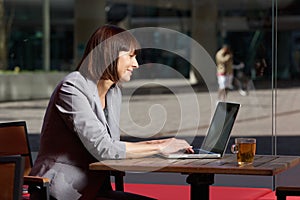 Business woman reading text message on mobile phone