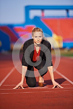 Business woman ready to sprint