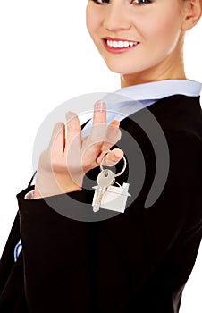 Business woman real estate agent holding keys