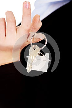 Business woman real estate agent holding keys