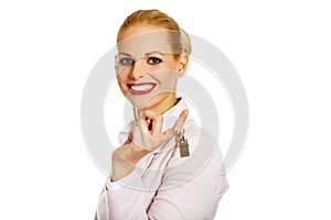 Business woman real estate agent holding keys