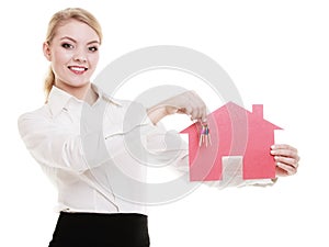 Business woman real estate agent holding red paper house keys