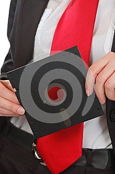 Business woman red tie holding floppy