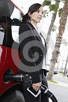 Business Woman Refueling Her Car