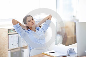 Business woman, relax and desk at office with documents on break for accounting or finance. Portrait of female person