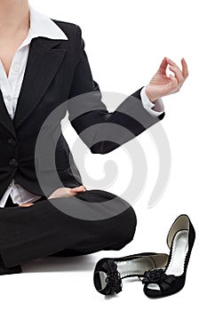 Business woman relaxing in the lotus position