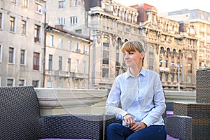 Business woman relaxing on the terrace.