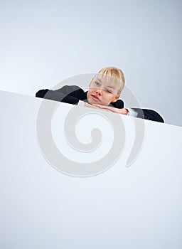 Business woman resting on wall. Portrait of business woman resting on wall - copyspace.