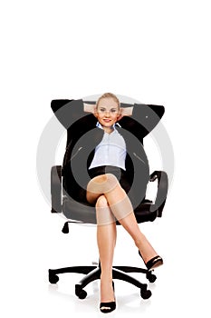 Business woman resting on wheel chair