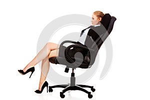 Business woman resting on wheel chair