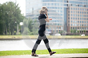 Business woman running on meeting and making call