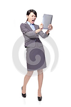 Business woman scream to tablet PC