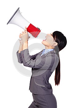 Business woman screaming in megaphone