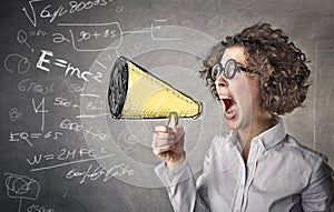 Business woman screaming with a megaphone
