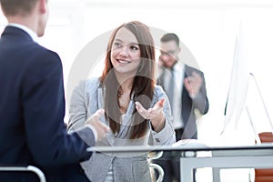 Business woman shaking hands with a business partner.