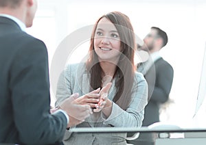 Business woman shaking hands with a business partner.